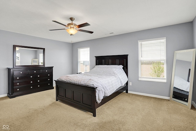 977 Capricorn Dr, Franklin, IN 46131 - bedroom with light colored carpet, baseboards, a ceiling fan, and visible vents