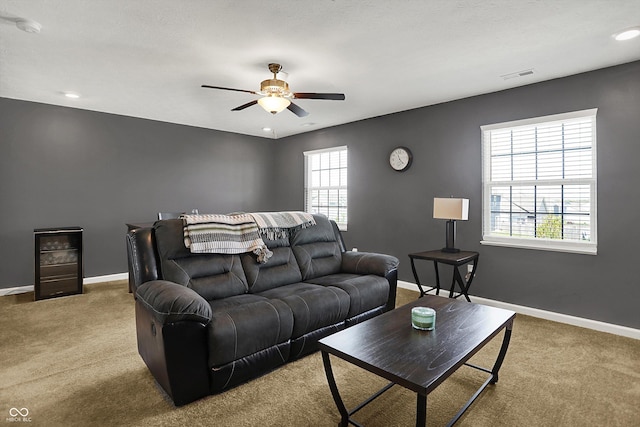 977 Capricorn Dr, Franklin, IN 46131 - living room featuring ceiling fan, carpet, baseboards, and visible vents