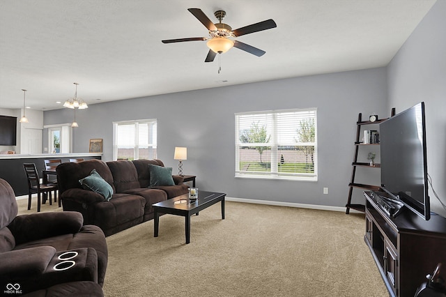 977 Capricorn Dr, Franklin, IN 46131 - living room featuring ceiling fan, light carpet, and baseboards