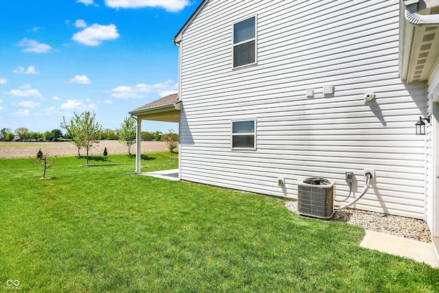 977 Capricorn Dr, Franklin, IN 46131 - view of side of home with central air condition unit and a lawn