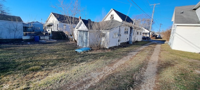 view of property exterior featuring a yard