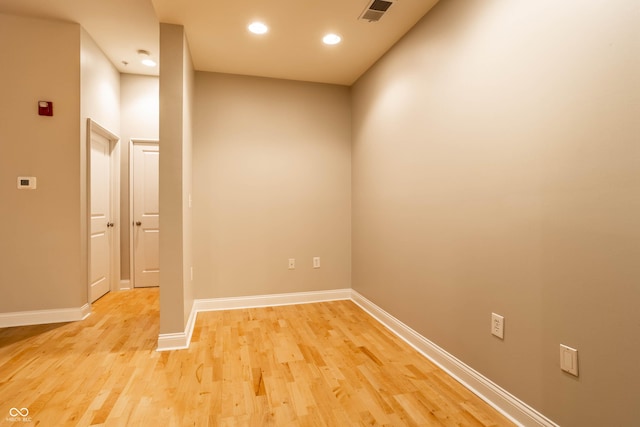 unfurnished room with light wood-type flooring