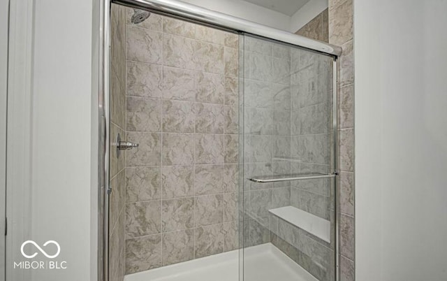 bathroom featuring an enclosed shower