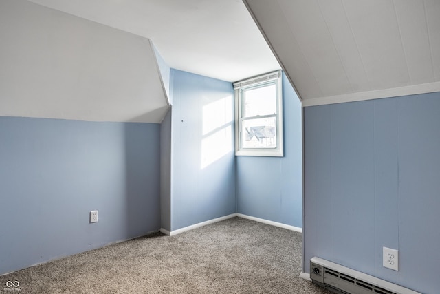 additional living space featuring vaulted ceiling, carpet, and baseboard heating