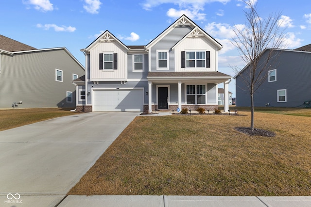 view of front of house featuring a garage, covered porch, and a front yard