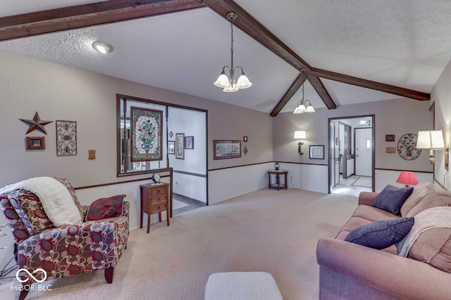 living room with a textured ceiling, light carpet, a notable chandelier, and vaulted ceiling with beams