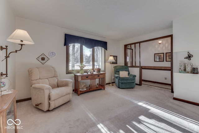 living area with light colored carpet