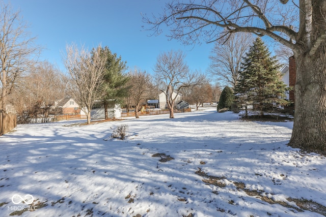 view of yard layered in snow