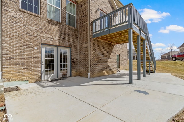 view of patio / terrace featuring stairs and a deck