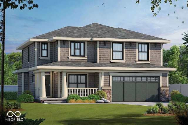 view of front of property featuring a garage, a front yard, and covered porch