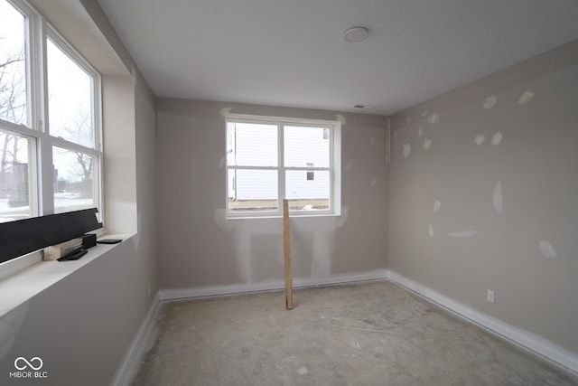 spare room featuring plenty of natural light