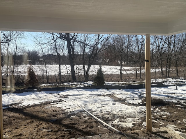 view of yard covered in snow