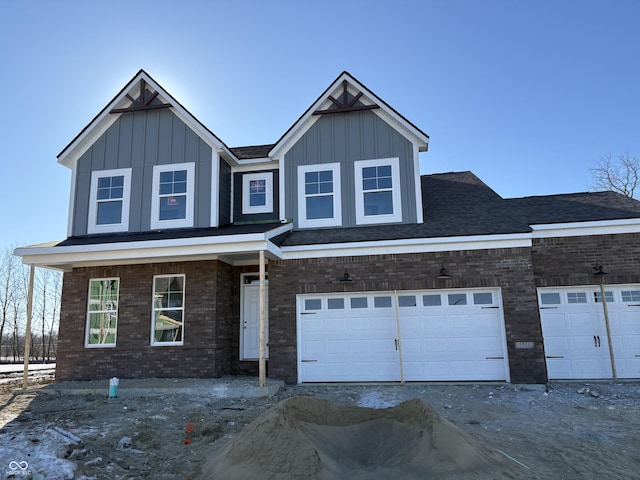 view of front of property featuring a garage and covered porch