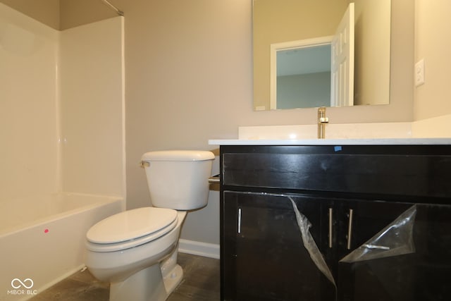 full bathroom with vanity, tub / shower combination, hardwood / wood-style floors, and toilet