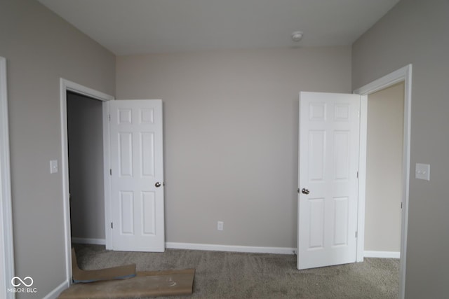 unfurnished bedroom with carpet floors