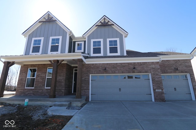 view of front of home with brick siding, board and batten siding, covered porch, and driveway