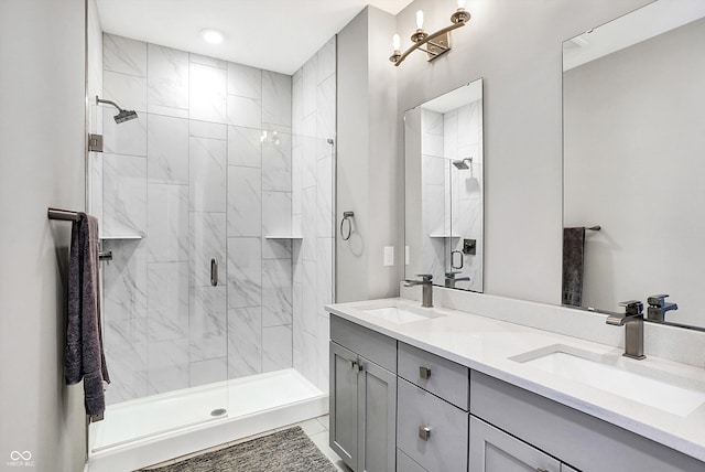 bathroom featuring vanity, a shower with door, and tile patterned flooring