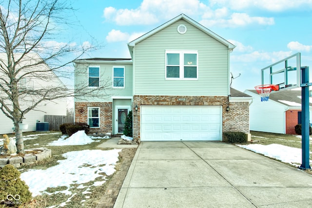 view of property with a garage and central AC