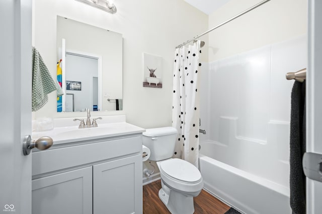 full bathroom with vanity, toilet, shower / tub combo, and hardwood / wood-style floors