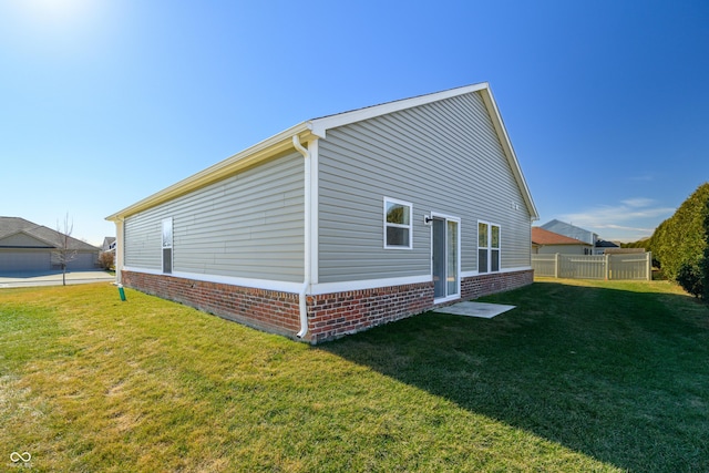 view of property exterior featuring a yard