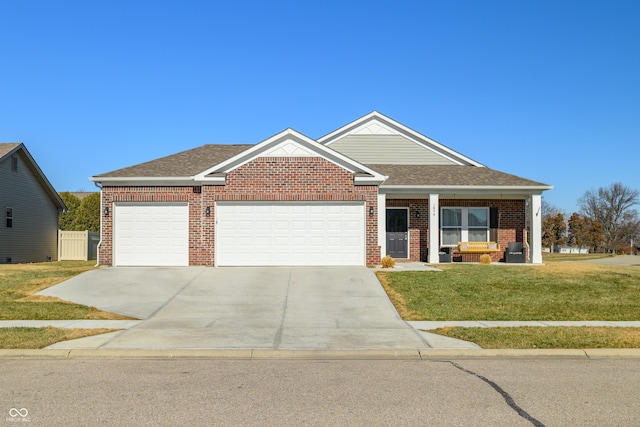 view of front of house featuring a garage and a front lawn