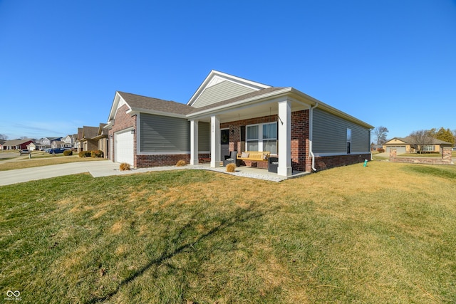 view of front of home with a garage, a porch, and a front lawn