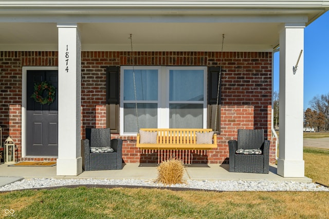 entrance to property featuring covered porch