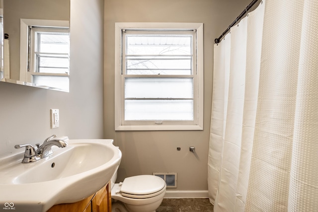 bathroom with toilet and sink