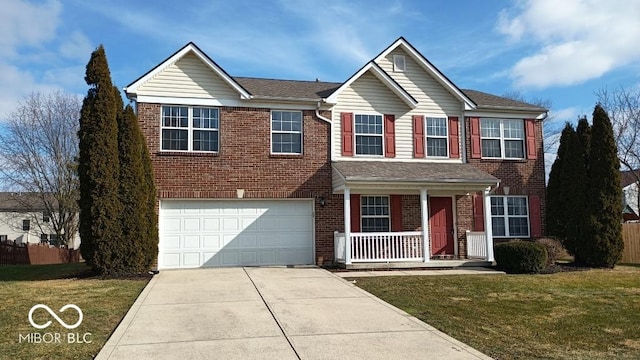 view of front of house with a garage, a front lawn, and a porch