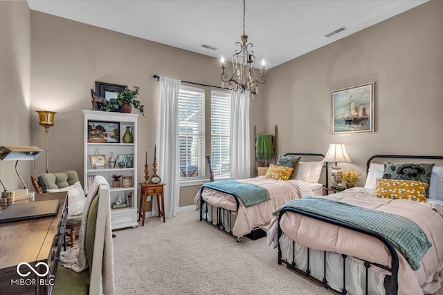 bedroom featuring a chandelier and light colored carpet