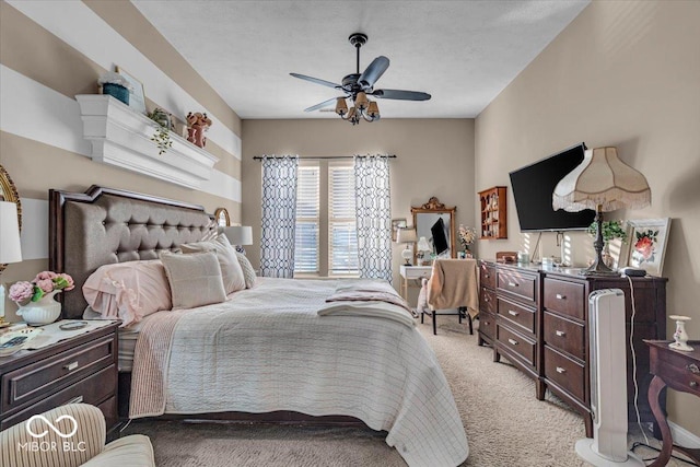 bedroom with ceiling fan and light colored carpet