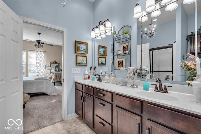 bathroom with ceiling fan, vanity, and tile patterned flooring