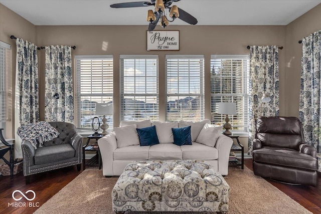 living room with ceiling fan, plenty of natural light, and dark hardwood / wood-style floors