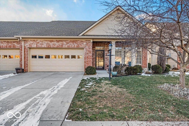 view of front of home featuring a garage and a front lawn