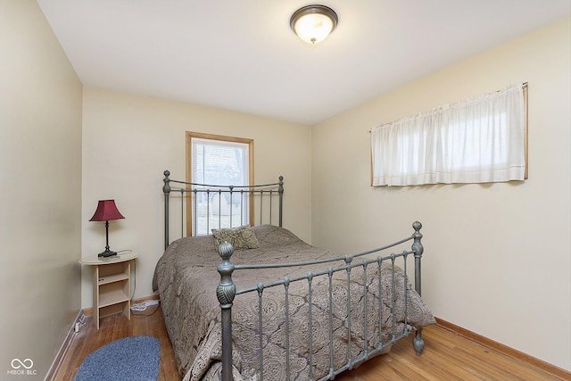 bedroom featuring wood-type flooring