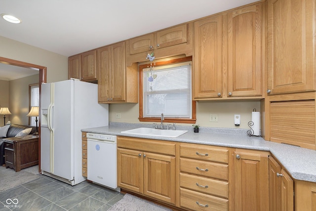 kitchen featuring sink and white appliances