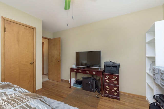 bedroom featuring hardwood / wood-style flooring and ceiling fan