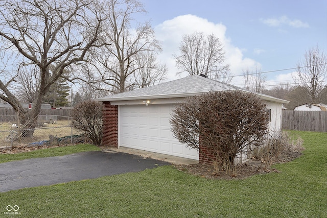 garage with a lawn