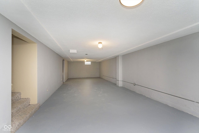 basement with a textured ceiling