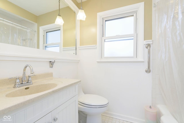 full bathroom with vanity, shower / bath combination with curtain, toilet, and a healthy amount of sunlight