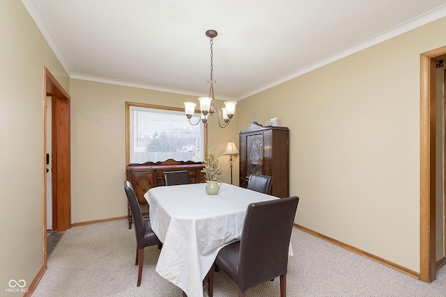 dining space with crown molding, a chandelier, and light carpet