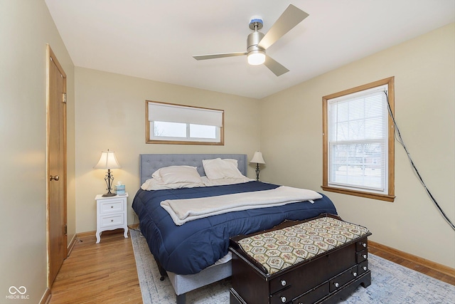 bedroom with ceiling fan and light hardwood / wood-style flooring