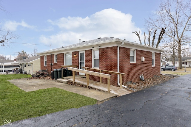 exterior space with a patio and a front yard