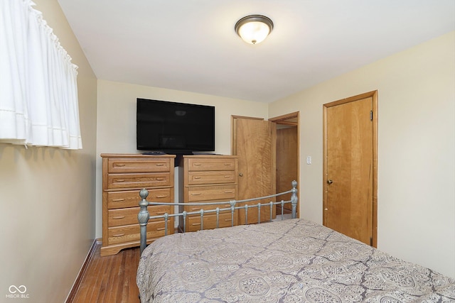 bedroom featuring dark wood-type flooring