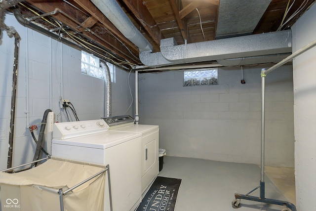 washroom with a healthy amount of sunlight and washer and dryer