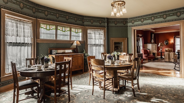 dining area featuring an inviting chandelier