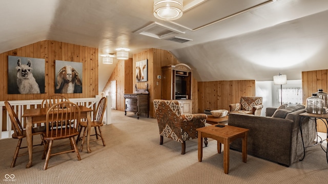 interior space featuring wooden walls, light carpet, and lofted ceiling