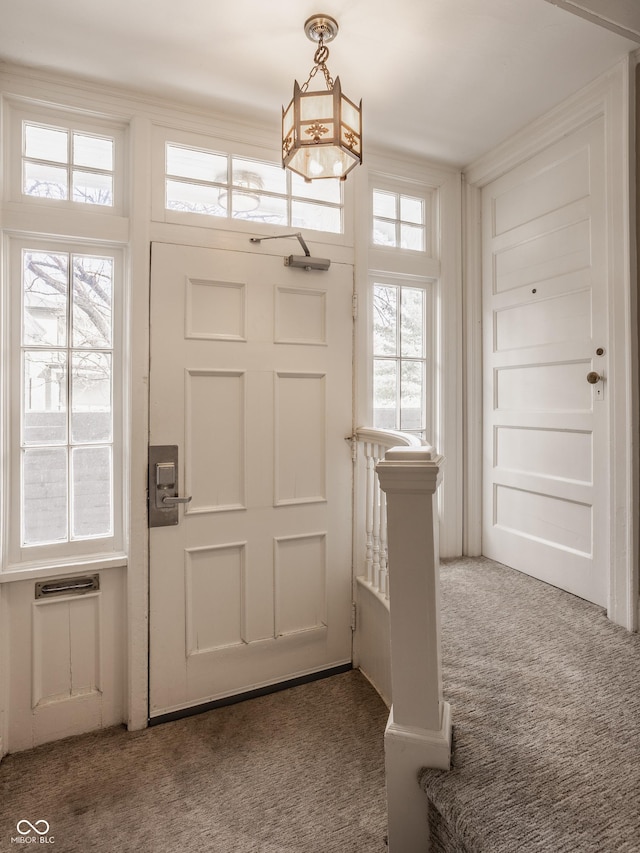 entryway with carpet flooring