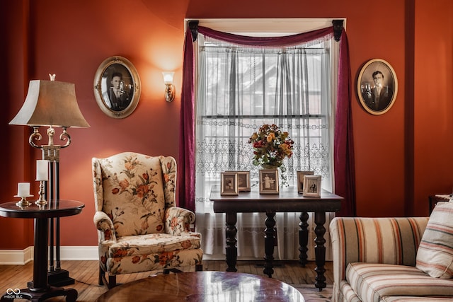 sitting room featuring hardwood / wood-style floors