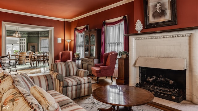 living area featuring crown molding and light hardwood / wood-style floors